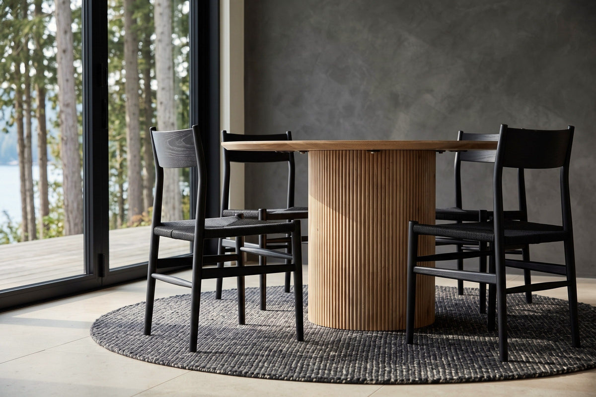 The Zuccarello base in Natural at seat height: one straight cylinder of narrow rounded reeds under the thin round top