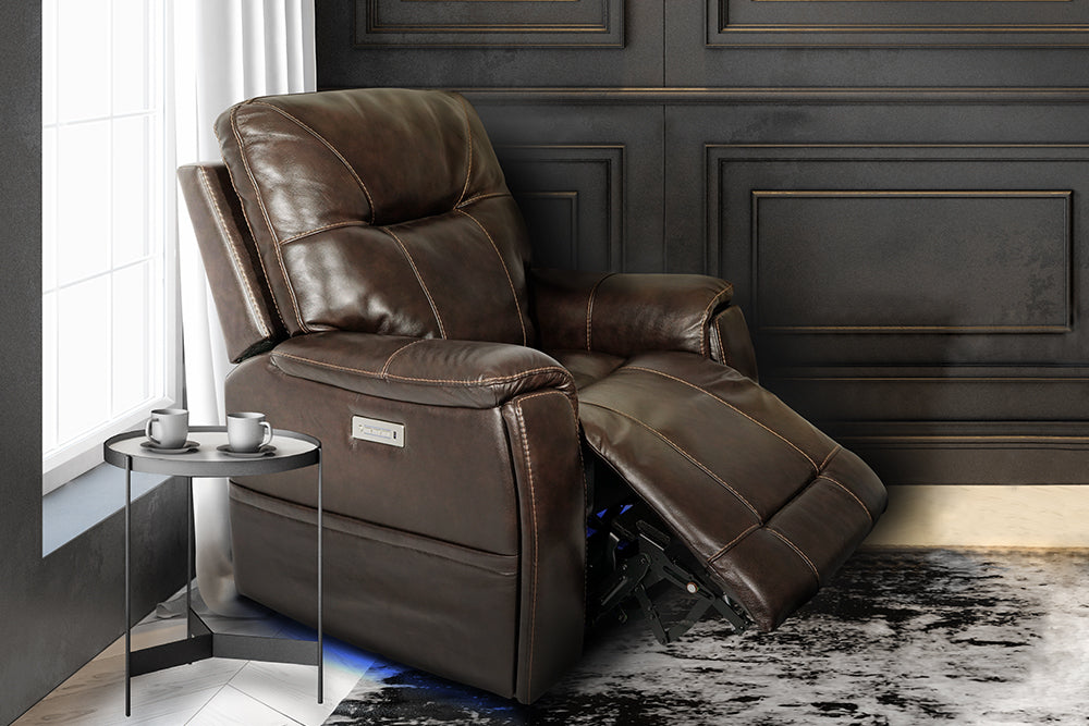 In a Living Room, There is Sitting Left Acute Angle Front View of A Classic, Dark Chocolate, Single Seat, Wood and Steel Frame, Campania Leather Recliner Chair.