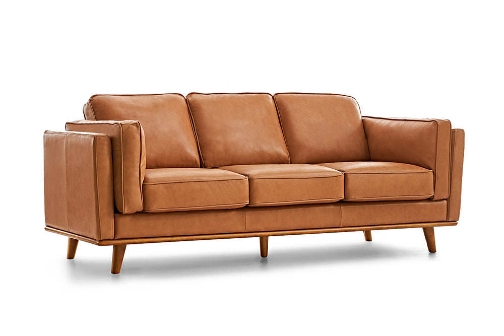 Left Angled Front View of A Modern, Cognac, Three Seats, Leather Artisan Sofa.