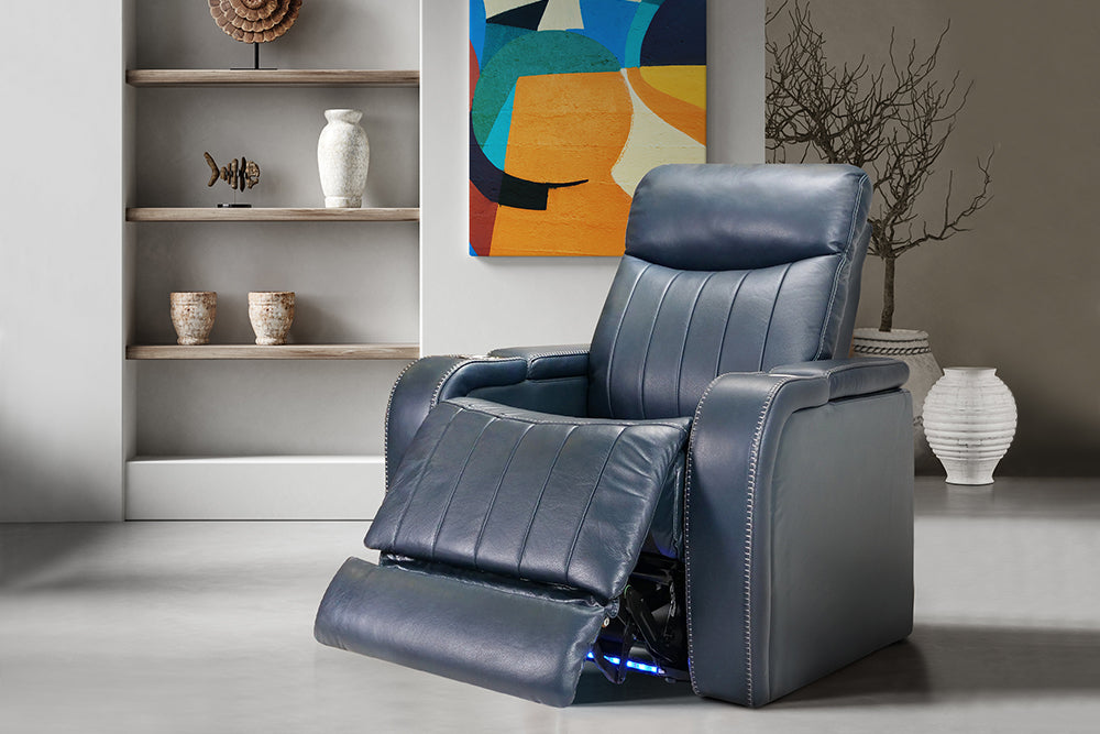 Right Angled Front View of A Modern, Navy Blue, Single Seat, Leather Recliner Chair in a Living Room.