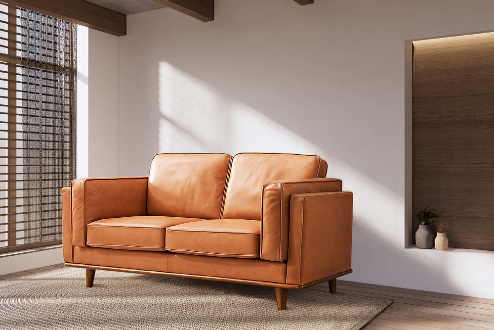 Right angled Front View of A Modern, Cognac, Loveseat, Leather Artisan Sofa in a Living Room.