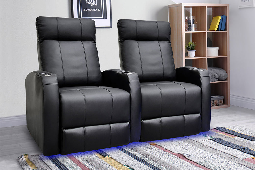 In a Living Room, There is Left Angled Front View of A Classic, Black, Two Seat, Plywood and Steel Frame, Syracuse Premium Top Grain Leather Home Theater Seating.